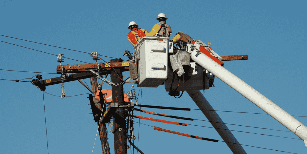 Electric utility field workers maintaining line
