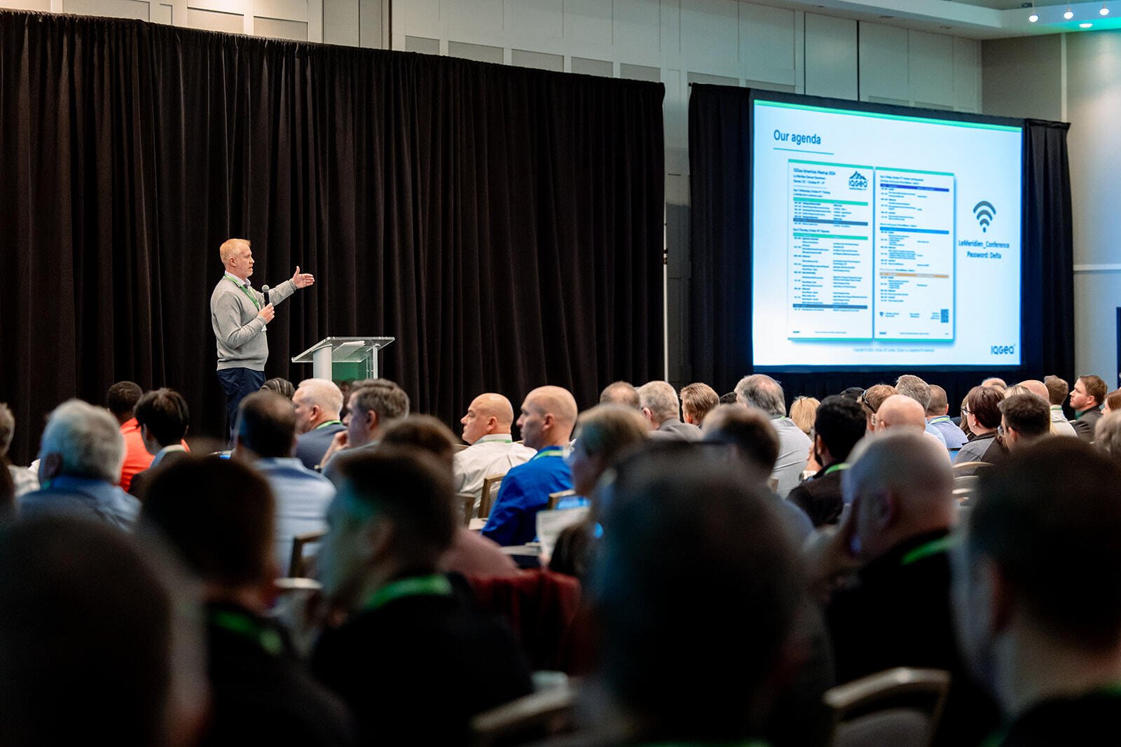 Jay Cadman presenting to a room of delegates at the 2024 IQGeo Americas Meetup
