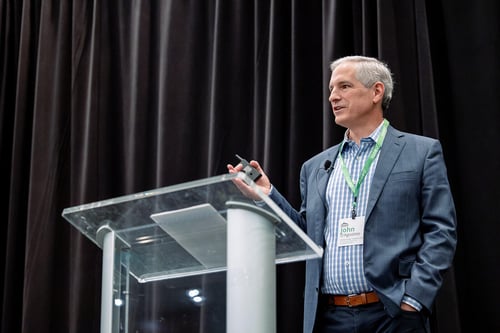 John D'Agostino  gives a keynote at the IQGeo Americas Meetup 2024