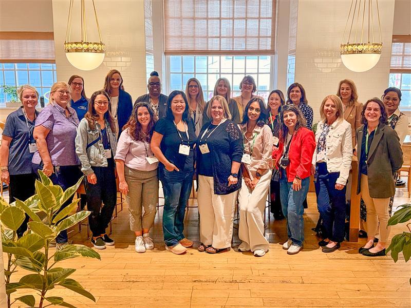A group of women standing together at the Women in Engineering Breakfast during the IQGeo Americas Meetup 2025