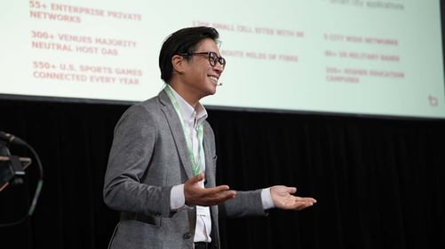 Presenter from Boldyn Networks gesticulates during his speech.