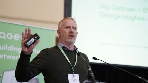 Jay Cadman, SVP Americas at IQGeo, gives an animated speech.