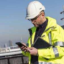 hi vis man with tablet
