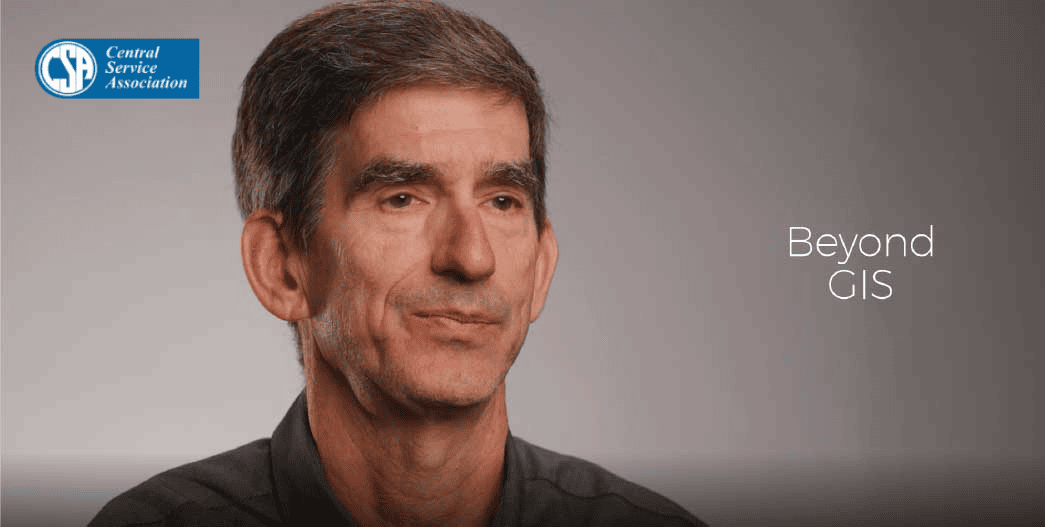 Central Service Association logo on the top left, grey background with the text “Beyond GIS” on the right side. A person is positioned centrally in the image wearing a dark shirt.